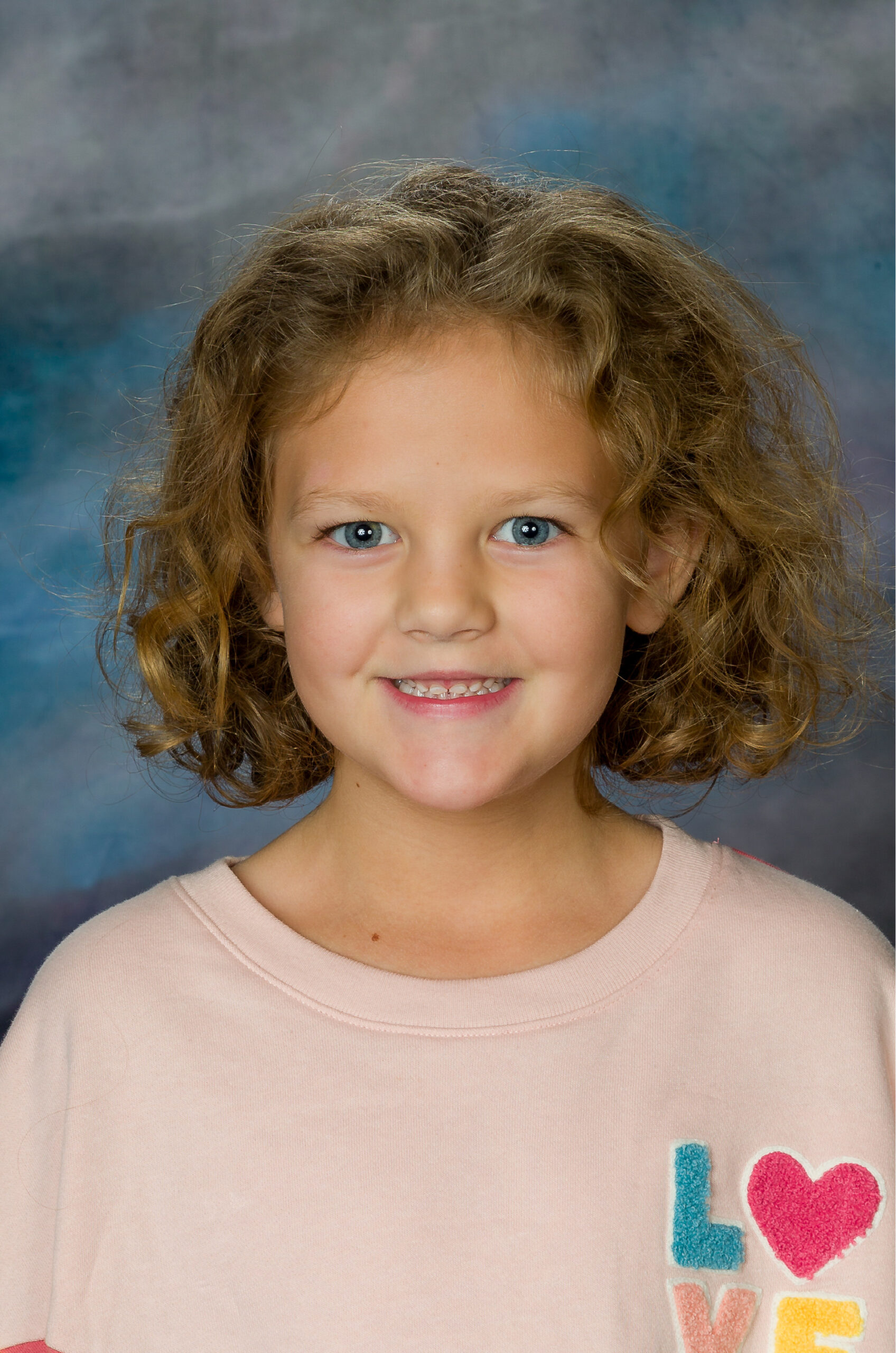 Image of a child in a pink shirt